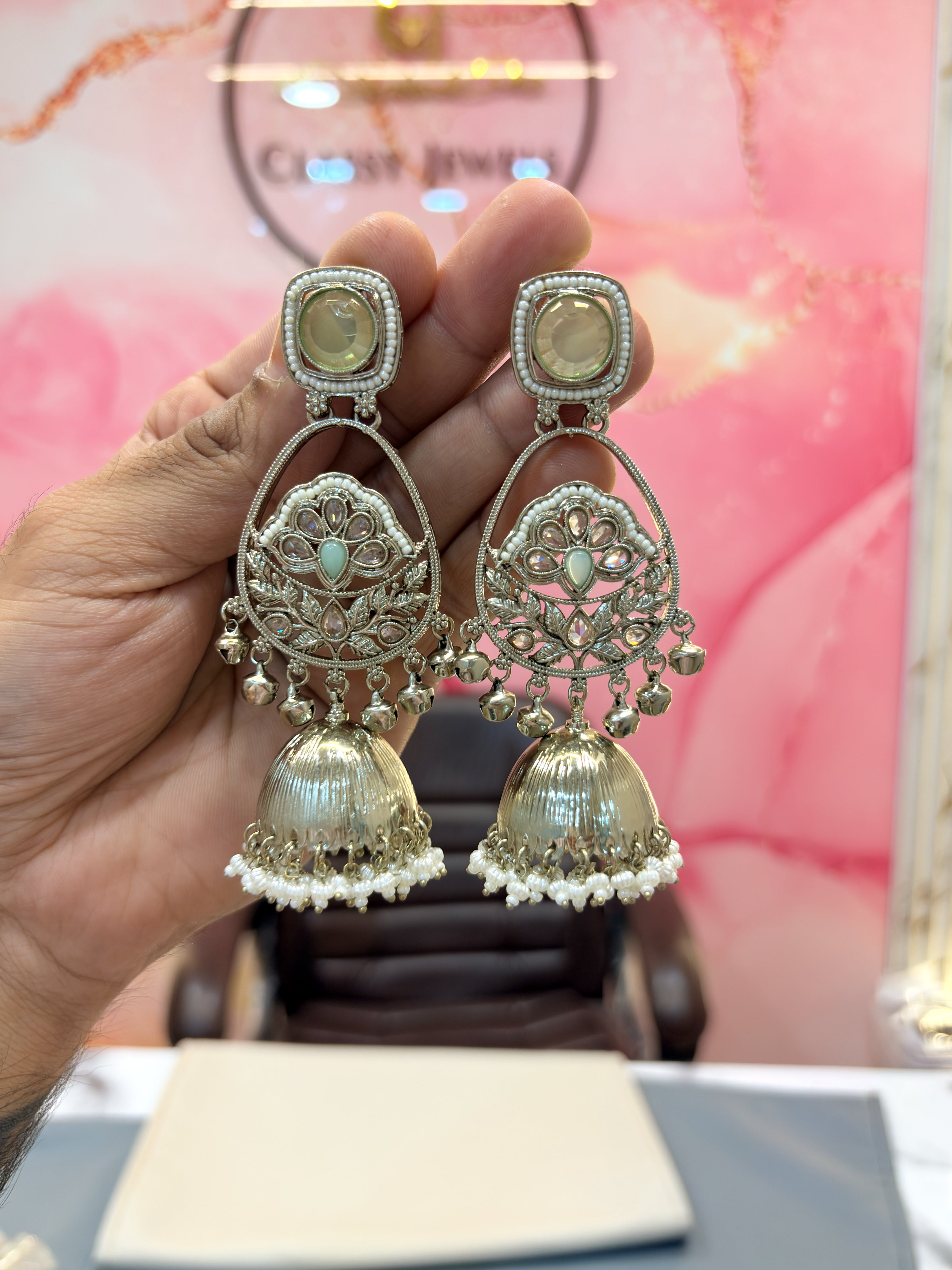 Intricate Jhumka Earrings with Stone and Pearl Detailing