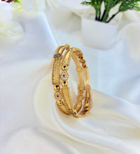 Everglow brass bangles image 0